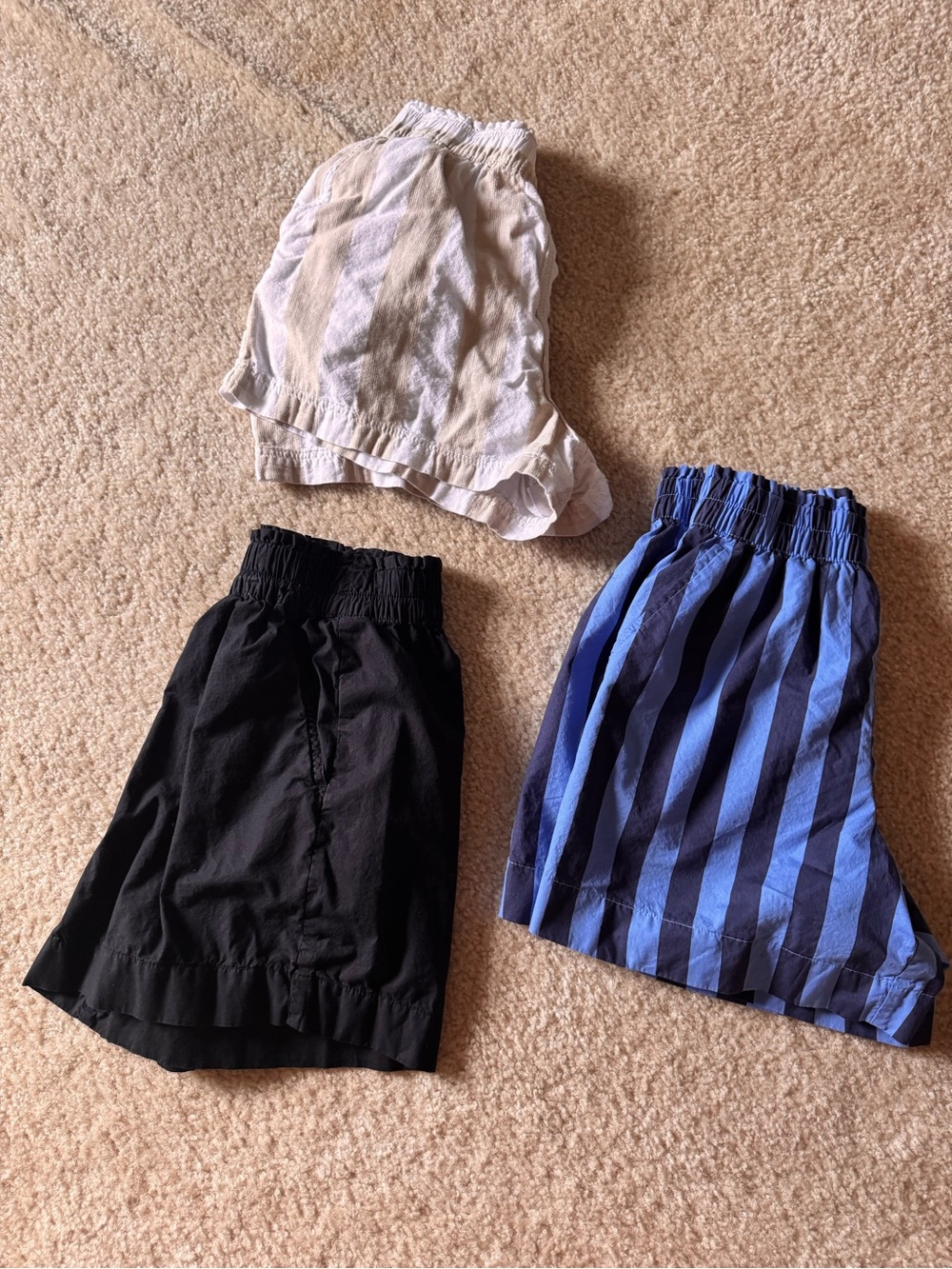 Three pieces of aerie and HM women’s Shorts Trio - Black, White, Blue Stripe